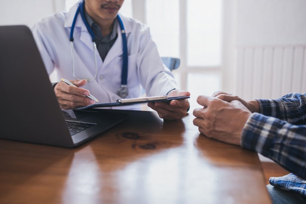 Young Medical Doctor Consulted Asian Young Man People Sexually Transmitted Diseases. Prostate And Venereal Cancer Detected.