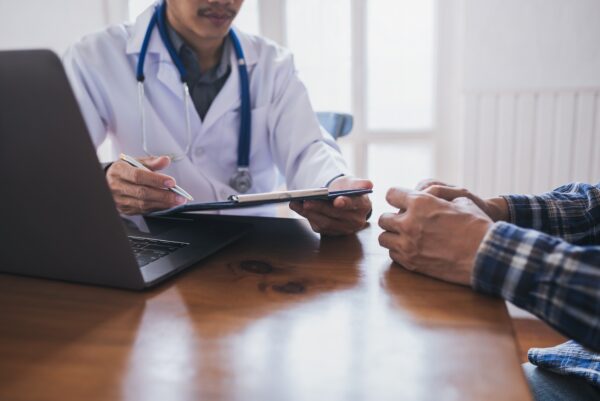 Young Medical Doctor Consulted Asian Young Man People Sexually Transmitted Diseases. Prostate And Venereal Cancer Detected.