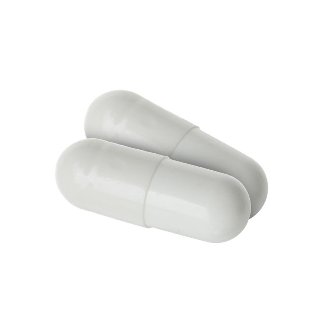Two white enclomiphene capsules on a white background.